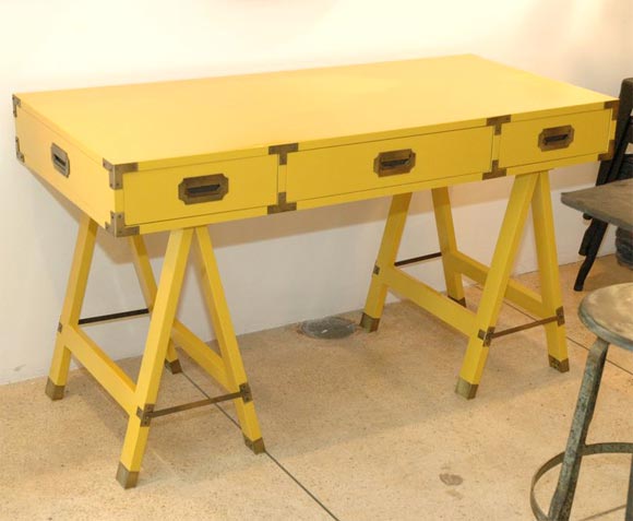 Desk has 3 drawers and rests on two matching A-frame stands.